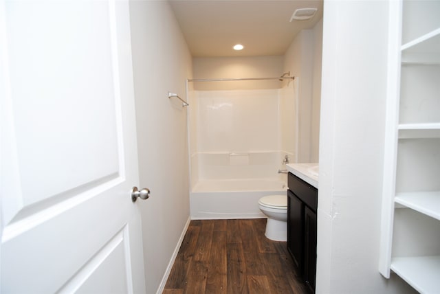 full bathroom featuring bathtub / shower combination, toilet, hardwood / wood-style flooring, and vanity