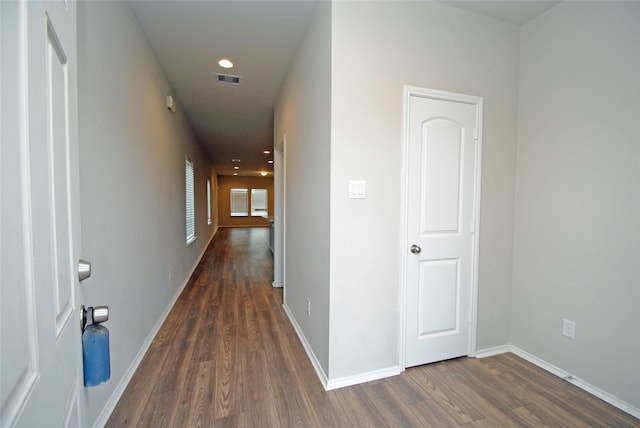 corridor featuring dark hardwood / wood-style flooring