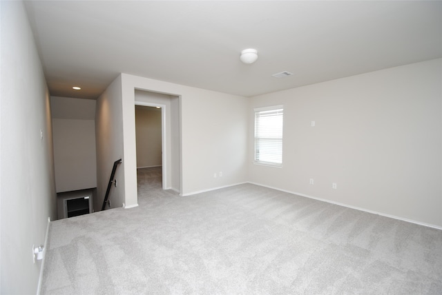 empty room with light colored carpet