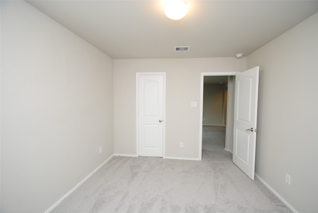 unfurnished bedroom with light carpet