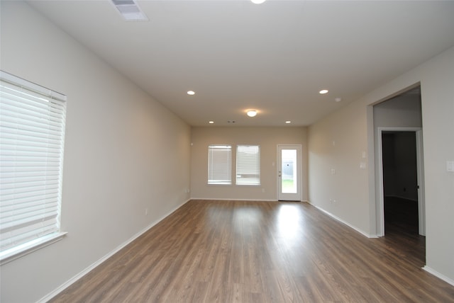 empty room featuring dark wood-type flooring