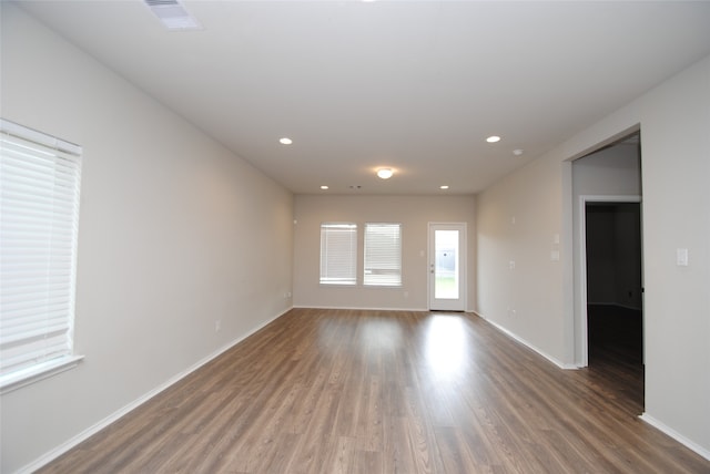 empty room featuring dark hardwood / wood-style flooring