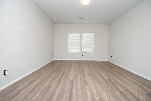 empty room with wood-type flooring