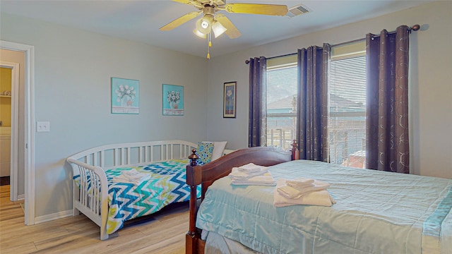 bedroom featuring light hardwood / wood-style floors and ceiling fan