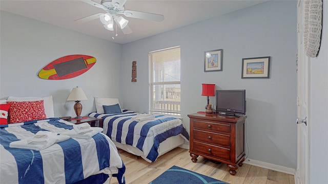 bedroom featuring ceiling fan and light wood-type flooring