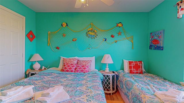 bedroom featuring ceiling fan and light wood-type flooring