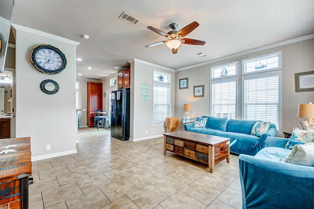 living room featuring ceiling fan, light tile patterned floors, and ornamental molding