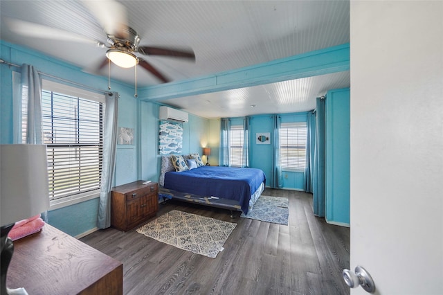 bedroom with billiards, dark hardwood / wood-style floors, ceiling fan, and a wall unit AC