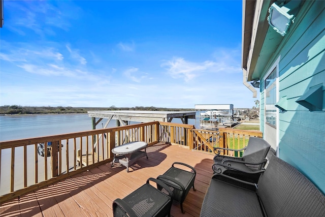 wooden deck with a water view