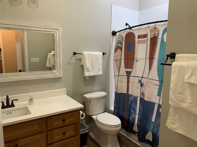 bathroom with toilet and vanity