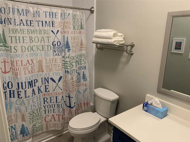 bathroom featuring toilet and vanity