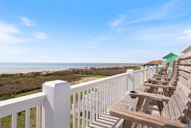 balcony with a view of the beach and a water view