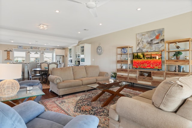 living room featuring crown molding, ceiling fan, wood finished floors, and recessed lighting