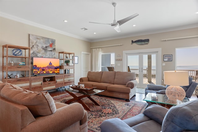 living area with french doors, crown molding, recessed lighting, visible vents, and wood finished floors