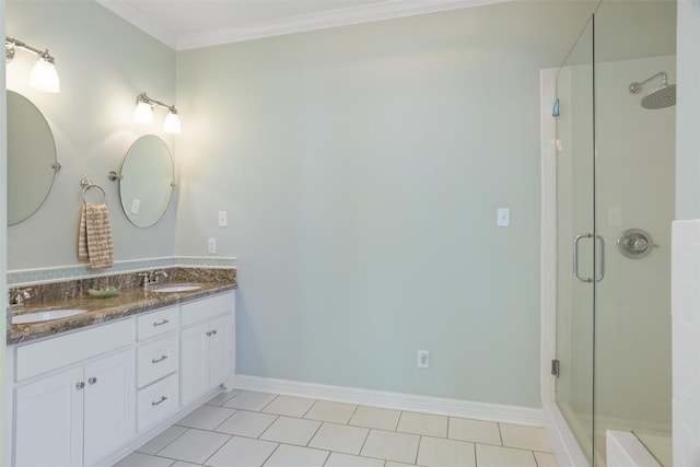 bathroom with ornamental molding, a stall shower, a sink, and double vanity