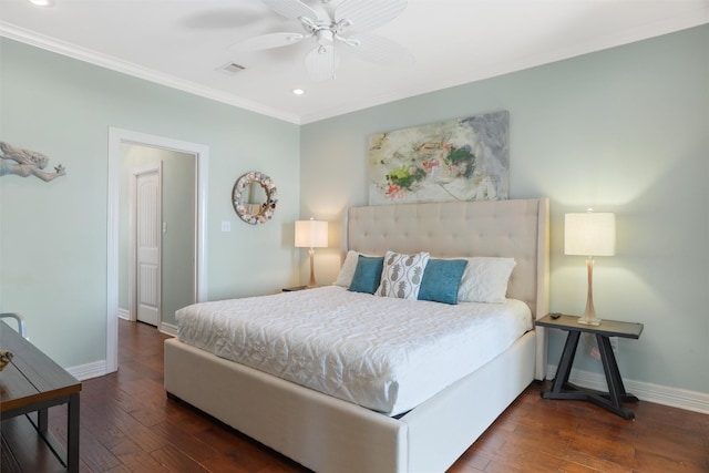 bedroom with dark wood-style floors, baseboards, visible vents, and crown molding