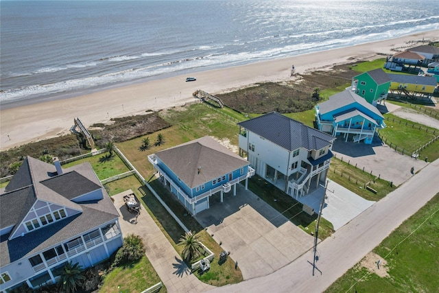 aerial view featuring a water view and a beach view