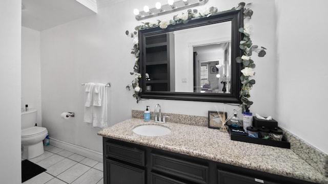 bathroom featuring tile patterned floors, toilet, ornamental molding, baseboards, and vanity