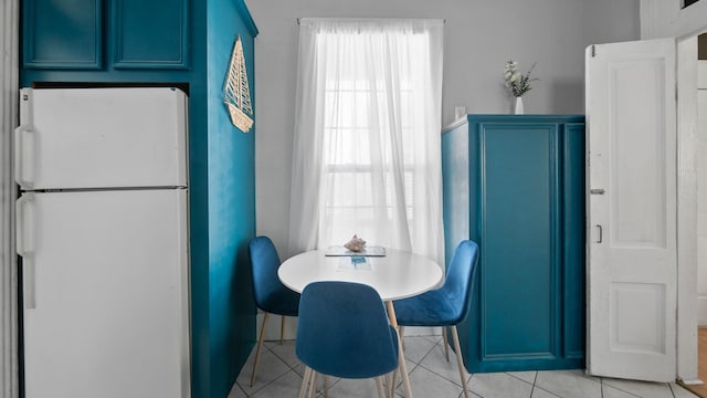 dining room featuring a wealth of natural light and light tile patterned floors