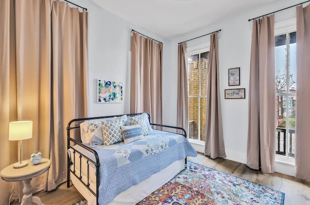 bedroom with wood finished floors