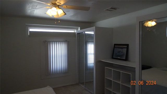 bathroom with plenty of natural light, ceiling fan, and tile flooring