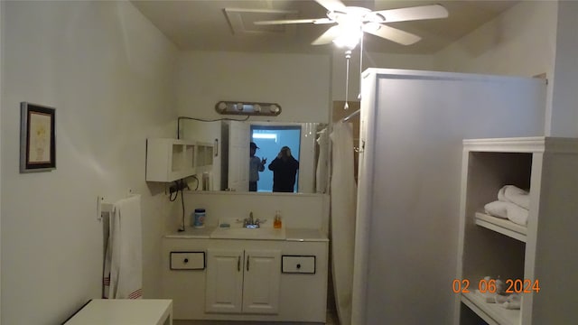 bathroom with ceiling fan and sink