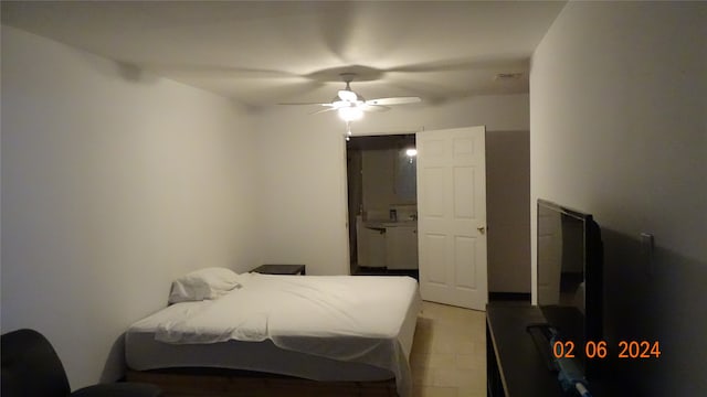 bedroom featuring ceiling fan and light tile floors