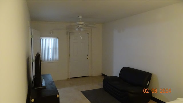 interior space featuring ceiling fan