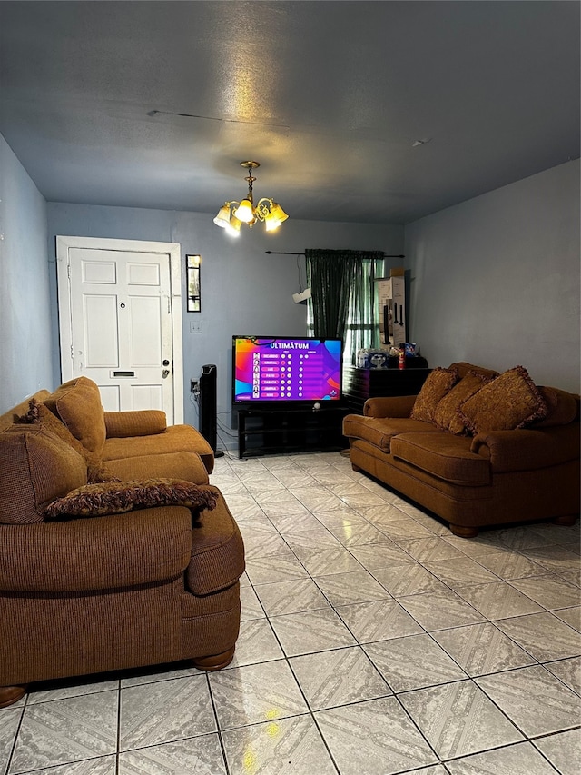 living room featuring light tile flooring and a notable chandelier