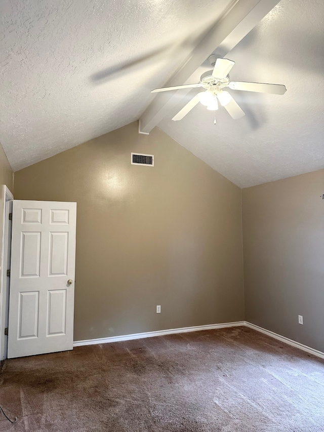 carpeted spare room with lofted ceiling with beams, ceiling fan, and a textured ceiling