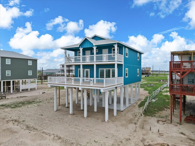 back of house with a balcony