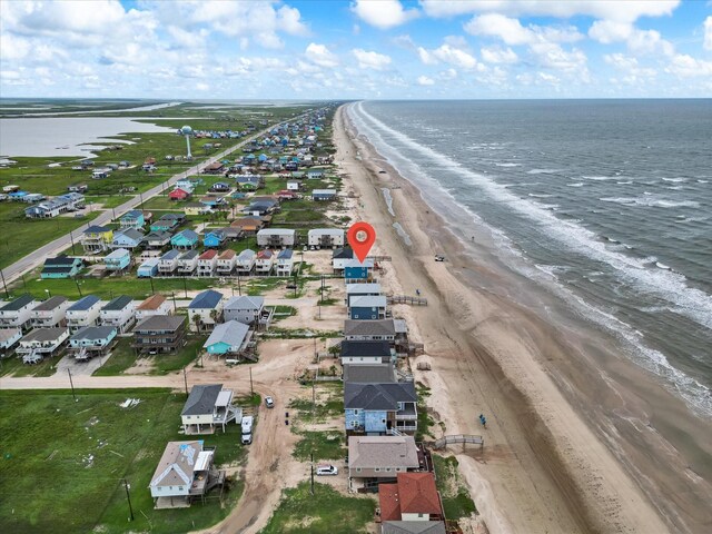 drone / aerial view with a view of the beach and a water view