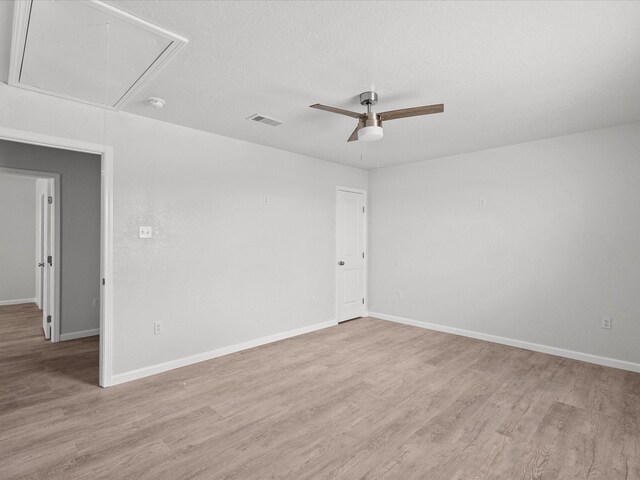 unfurnished room featuring ceiling fan and light hardwood / wood-style floors