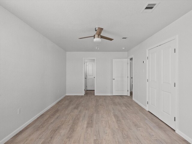 interior space featuring light wood-type flooring and ceiling fan