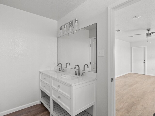 bathroom with vanity, hardwood / wood-style floors, and ceiling fan