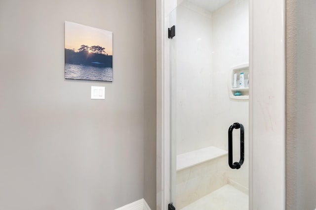 bathroom featuring an enclosed shower