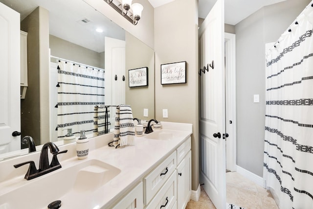 bathroom with vanity and tile patterned floors