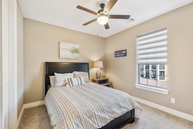 bedroom featuring light carpet and ceiling fan