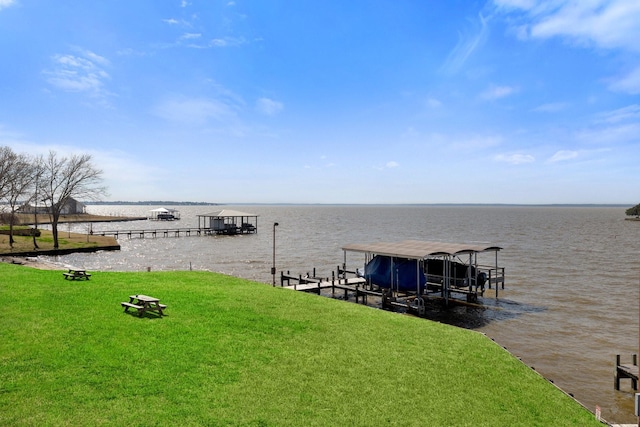 view of dock featuring a yard and a water view