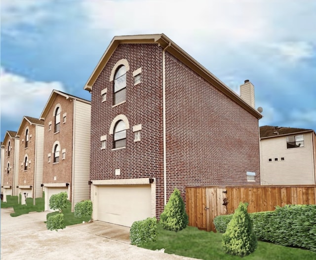 view of side of home featuring a garage