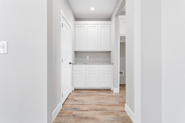 corridor featuring light hardwood / wood-style floors