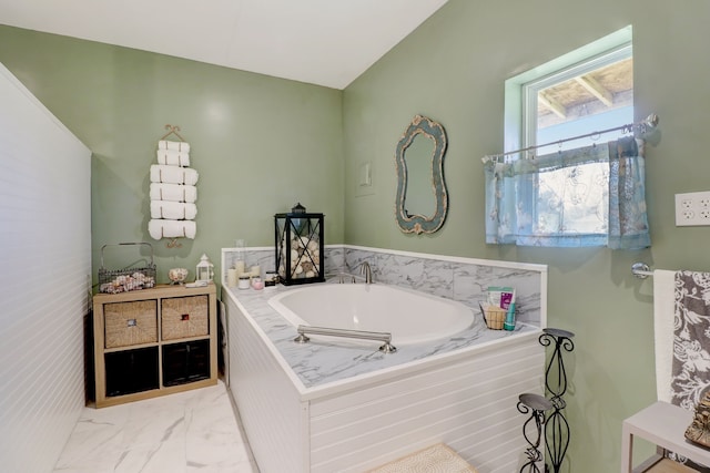 bathroom featuring a relaxing tiled tub