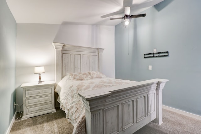 bedroom featuring ceiling fan, carpet, and vaulted ceiling