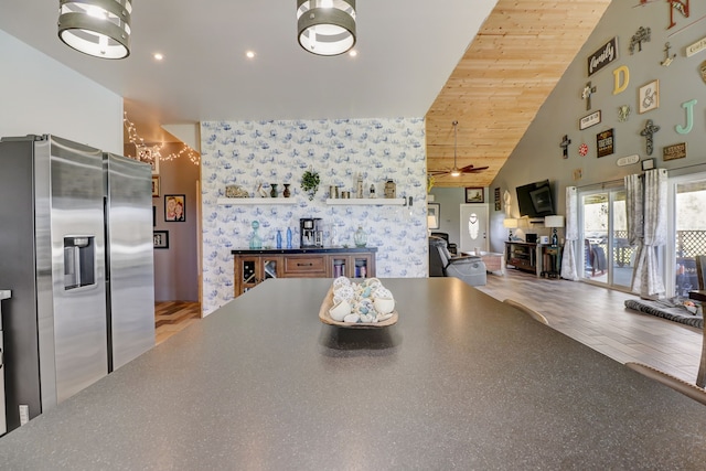 kitchen with wooden ceiling, stainless steel fridge, high vaulted ceiling, light hardwood / wood-style floors, and ceiling fan