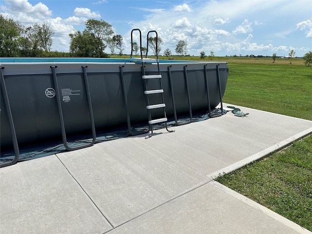 view of storm shelter with a yard