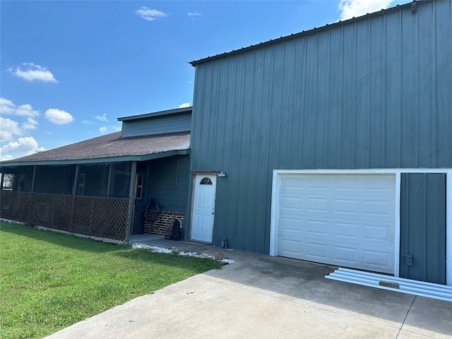 view of front of property with a front lawn and a garage