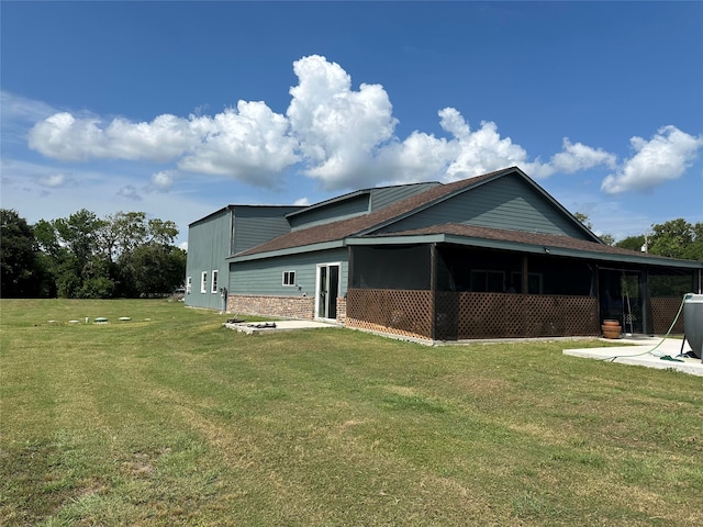 view of side of home featuring a lawn