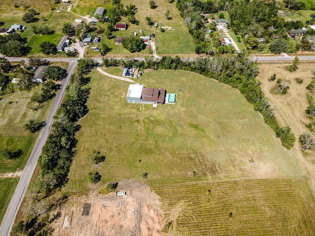 birds eye view of property featuring a rural view