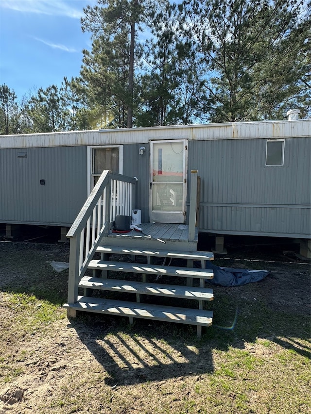 property entrance with a deck