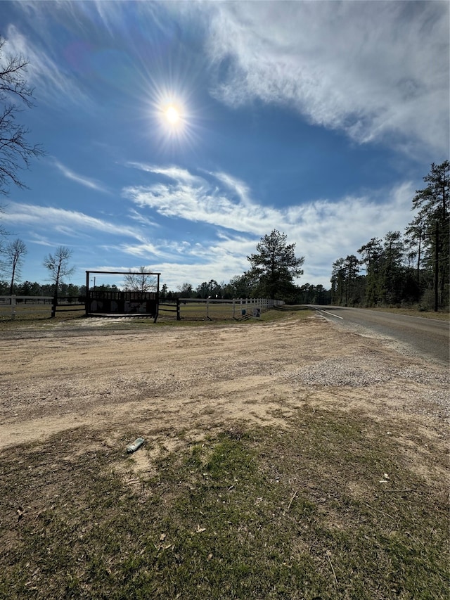 view of yard with a rural view